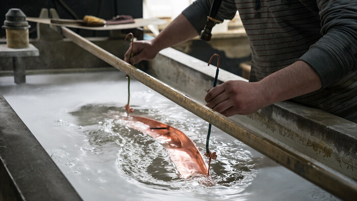 Electroplating with hot water produced by a compressed air compressor.