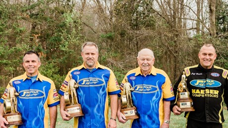 JEB Four Racing team with tropies